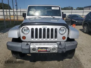 2009 Jeep Wrangler Sahara with VIN 1J4FA54119L747068, listed as a Copart auction lot 71209904 with 86,978 mi miles and Salvage title. Bid and sale history available at DreamBid. Image 5.