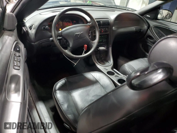 2003 Ford Mustang Deluxe z VIN 1FAFP44433F369534, wystawiony jako Copart lot #76606794 z przebiegiem 88 503 mil mil oraz Szkoda całkowita • Salvage title. Historia ofert i sprzedaży dostępna na DreamBid. Obrazek 8.