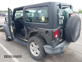 2016 Jeep Wrangler Willys Wheeler with VIN 1C4GJWAG2GL318981, listed as a IAAI auction lot 42390588 with 131,559 mi miles and . Bid and sale history available at DreamBid. Image 3.