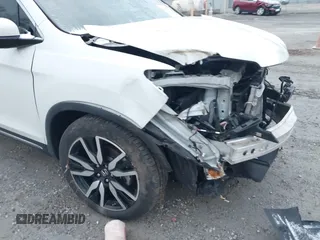 2020 Honda Pilot Touring 8-Passenger with VIN 5FNYF6H96LB056229, listed as a IAAI auction lot 41738249 with 65,099 mi miles and . Bid and sale history available at DreamBid. Image 19.