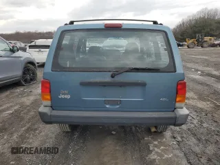 1999 Jeep Cherokee SE with VIN 1J4FF28S9XL576313, listed as a Copart auction lot 88470435 with Not provided miles and Salvage title. Bid and sale history available at DreamBid. Image 6.
