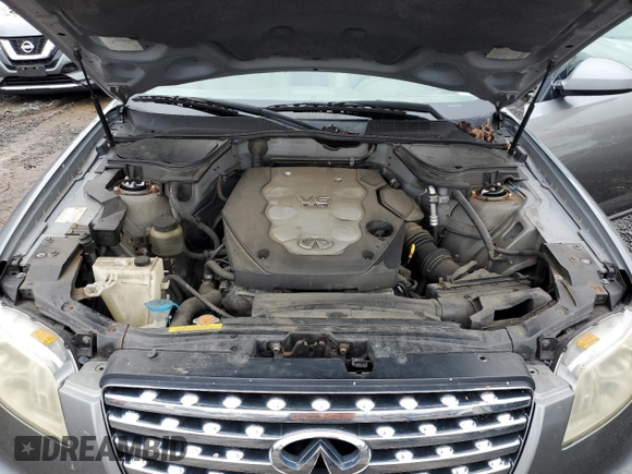2005 Infiniti FX z VIN JNRAS08W45X205908, wystawiony jako Copart lot #85388704 z przebiegiem 233 492 mil mil oraz Tytuł czysty. Historia ofert i sprzedaży dostępna na DreamBid. Obrazek 12.