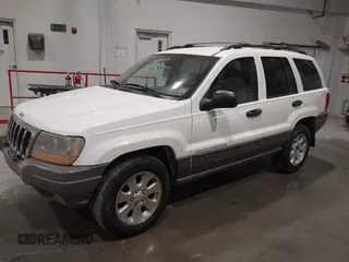 2000 Jeep Grand Cherokee Laredo z VIN 1J4GW48NXYC244327, wystawiony jako IAAI lot #41832166 z przebiegiem 250 822 mil mil oraz . Historia ofert i sprzedaży dostępna na DreamBid. Obrazek 2.