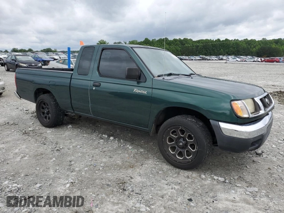 2000 Nissan Frontier XE with VIN 1N6DD26SXYC400648, listed as a Copart auction lot 58756855 with 148,051 mi miles and Salvage title. Bid and sale history available at DreamBid. Image 4.