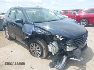 2016 Mazda CX-5 Sport z VIN JM3KE2BY0G0633611, wystawiony jako IAAI lot #42390654 z przebiegiem Nie podano mil oraz . Historia ofert i sprzedaży dostępna na DreamBid. Obrazek 1.