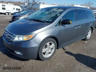 2013 Honda Odyssey Touring with VIN 5FNRL5H97DB018839, listed as a IAAI auction lot 41884016 with 171,650 mi miles. Bid and sale history available at carsss.com. Image 17.