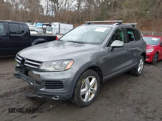2013 Volkswagen Touareg Lux with VIN WVGEF9BP0DD005082, listed as a IAAI auction lot 41667026 with 140,148 mi miles and . Bid and sale history available at DreamBid. Image 2.
