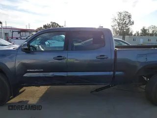 2021 Toyota Tacoma SR5 z VIN 3TMDZ5BN6MM110938, wystawiony jako IAAI lot #41838703 z przebiegiem 67 680 mil mil oraz . Historia ofert i sprzedaży dostępna na DreamBid. Obrazek 14.