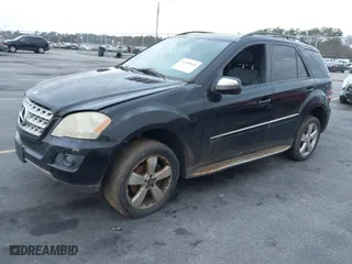 2009 Mercedes-Benz M-Class 3.5L with VIN 4JGBB86E19A526029, listed as a IAAI auction lot 41209546 with 220,885 mi miles. Bid and sale history available at carsss.com. Image 2.