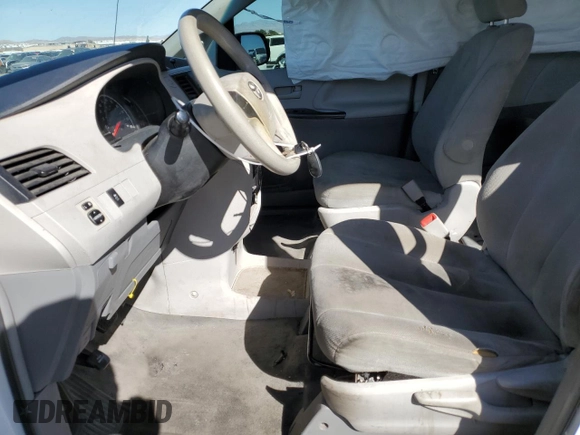 2012 Toyota Sienna with VIN 5TDZK3DC2CS244967, listed as a Copart auction lot 49787795 with 242,667 mi miles and Salvage Title. Bid and sale history available at carsss.com. Image 7.