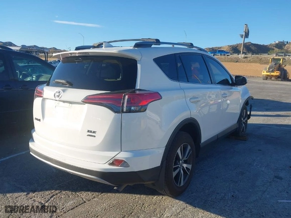 2018 Toyota RAV4 XLE with VIN JTMRFREV0JJ735636, listed as a IAAI auction lot 41658305 with 94,944 mi miles. Bid and sale history available at carsss.com. Image 4.