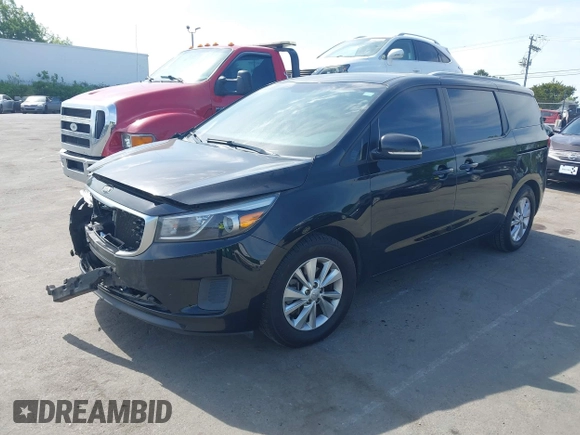 2015 Kia Sedona LX with VIN KNDMB5C17F6069139, listed as a IAAI auction lot 42064125 with 226,244 mi miles and . Bid and sale history available at DreamBid. Image 2.