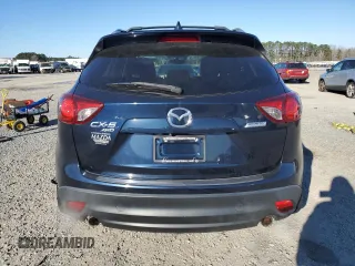 2014 Mazda CX-5 Grand Touring with VIN JM3KE4DY1E0405493, listed as a Copart auction lot 41688915 with 94,970 mi miles and Salvage Title. Bid and sale history available at carsss.com. Image 6.
