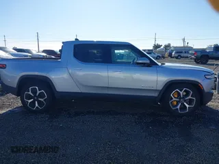 2023 Rivian R1T Adventure with VIN 7FCTGAAA0PN021864, listed as a IAAI auction lot 41620630 with 1 mi miles. Bid and sale history available at carsss.com. Image 13.