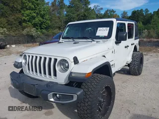 2018 Jeep Wrangler Unlimited Sahara z VIN 1C4HJXEG4JW220092, wystawiony jako IAAI lot #40522478 z przebiegiem 90 529 mil mil oraz . Historia ofert i sprzedaży dostępna na DreamBid. Obrazek 17.