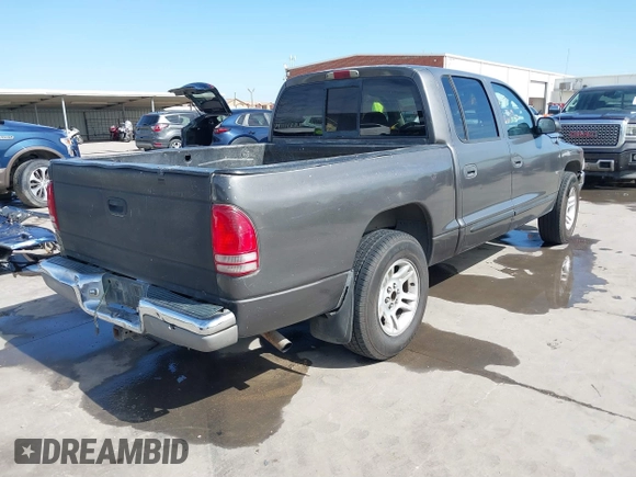 2001 Dodge Dakota z VIN 1B7HL2AX51S333575, wystawiony jako IAAI lot #41782582 z przebiegiem 291 640 mil mil oraz . Historia ofert i sprzedaży dostępna na DreamBid. Obrazek 4.