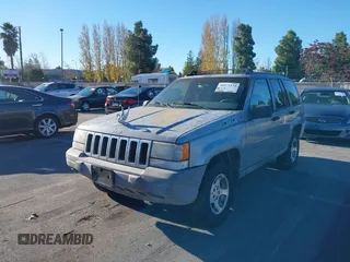 1996 Jeep Grand Cherokee Laredo with VIN 1J4FX58S8TC169575, listed as a IAAI auction lot 40971134 with 152,116 mi miles. Bid and sale history available at carsss.com. Image 6.