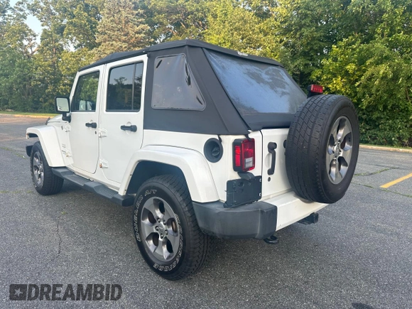 2016 Jeep Wrangler Unlimited Sahara with VIN 1C4BJWEG5GL215915, listed as a Copart auction lot 61690145 with 143,925 mi miles and Clean title. Bid and sale history available at DreamBid. Image 3.