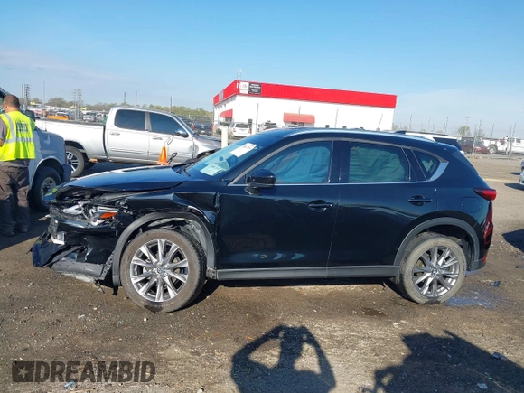 2020 Mazda CX-5 Grand Touring with VIN JM3KFBDM0L0790508, listed as a IAAI auction lot 41883319 with 114,398 mi miles and . Bid and sale history available at carsss.com. Image 14.
