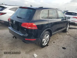 2012 Volkswagen Touareg Exec with VIN WVGEF9BP1CD011407, listed as a Copart auction lot 79199754 with 57,376 mi miles and Salvage Title. Bid and sale history available at DreamBid. Image 3.