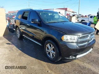 2013 Dodge Durango Crew with VIN 1C4SDHDT3DC553939, listed as a IAAI auction lot 41404491 with 148,505 mi miles and . Bid and sale history available at carsss.com. Image 1.