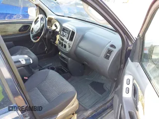 2003 Ford Escape XLT Popular 2 with VIN 1FMYU93103KE17610, listed as a IAAI auction lot 41766806 with 1 mi miles. Bid and sale history available at carsss.com. Image 5.