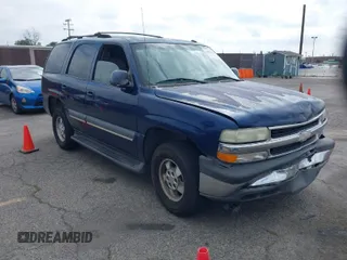 2003 Chevrolet Tahoe LS with VIN 1GNEC13T73R263893, listed as a IAAI auction lot 41906772 with 211,759 mi miles. Bid and sale history available at carsss.com. Image 1.