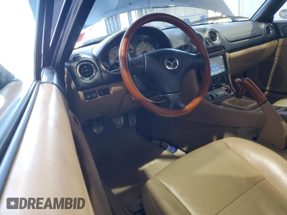 2001 Mazda MX-5 Miata with VIN JM1NB353510209224, listed as a Copart auction lot 51736955 with 103,732 mi miles and Salvage Title. Bid and sale history available at DreamBid. Image 8.