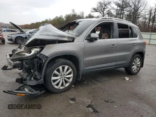 2011 Volkswagen Tiguan SE with VIN WVGBV7AX4BW556807, listed as a Copart auction lot 82098664 with Not provided miles and Salvage title. Bid and sale history available at DreamBid. Image 1.