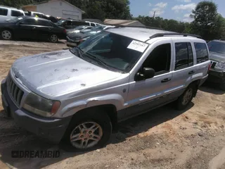 2004 Jeep Grand Cherokee Laredo z VIN 1J4GW48SX4C309998, wystawiony jako IAAI lot #42307167 z przebiegiem 306 912 mil mil oraz . Historia ofert i sprzedaży dostępna na DreamBid. Obrazek 2.