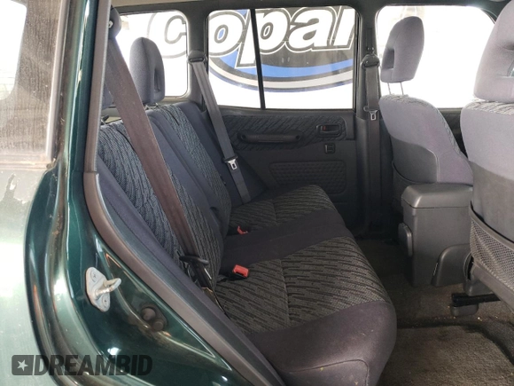 2000 Toyota RAV4 z VIN JT3GP10V6Y7072582, wystawiony jako Copart lot #60486825 z przebiegiem 182 699 mil mil oraz Szkoda całkowita • Salvage title. Historia ofert i sprzedaży dostępna na DreamBid. Obrazek 10.