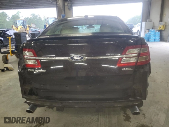 2014 Ford Taurus SEL z VIN 1FAHP2E80EG128686, wystawiony jako Copart lot #57158255 z przebiegiem 69 529 mil mil oraz Szkoda całkowita • Salvage title. Historia ofert i sprzedaży dostępna na DreamBid. Obrazek 6.