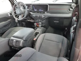 2024 Jeep Wrangler Rubicon z VIN 1C4PJXFG6RW261748, wystawiony jako Copart lot #44166485 z przebiegiem 7 911 mil mil oraz Szkoda całkowita • Salvage title. Historia ofert i sprzedaży dostępna na DreamBid. Obrazek 8.