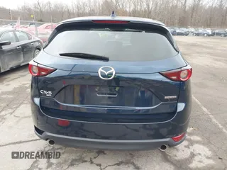 2021 Mazda CX-5 Touring with VIN JM3KFBCM7M1380396, listed as a IAAI auction lot 41707612 with 55,555 mi miles. Bid and sale history available at carsss.com. Image 16.