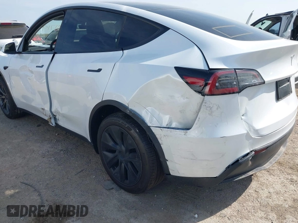 2025 Tesla Model Y Long Range z VIN 7SAYGDED7SA373784, wystawiony jako IAAI lot #41881719 z przebiegiem 1 192 mil mil oraz . Historia ofert i sprzedaży dostępna na DreamBid. Obrazek 20.