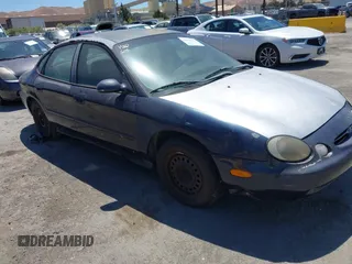 1998 Ford Taurus LX z VIN 1FAFP52U2WG156033, wystawiony jako IAAI lot #42819643 z przebiegiem 144 996 mil mil oraz . Historia ofert i sprzedaży dostępna na DreamBid. Obrazek 1.