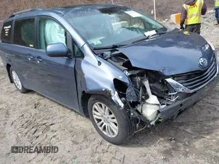2014 Toyota Sienna XLE with VIN 5TDYK3DC9ES511035, listed as a IAAI auction lot 41884115 with 153,071 mi miles. Bid and sale history available at carsss.com. Image 1.