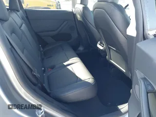 2025 Tesla Model Y Long Range with VIN 7SAYGDED7SA376233, listed as a IAAI auction lot 41777876 with 70 mi miles and . Bid and sale history available at DreamBid. Image 8.