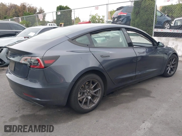 2023 Tesla Model 3 with VIN 5YJ3E1EA4PF705949, listed as a IAAI auction lot 42336682 with 88,056 mi miles and . Bid and sale history available at DreamBid. Image 4.