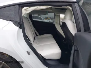 2022 Tesla Model 3 Long Range with VIN 5YJ3E1EB0NF129945, listed as a IAAI auction lot 41965531 with 59,162 mi miles and . Bid and sale history available at DreamBid. Image 8.