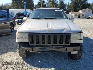 1997 Jeep Grand Cherokee Limited with VIN 1J4GZ78Y5VC598822, listed as a Copart auction lot 74306474 with 276,454 mi miles and Salvage Title. Bid and sale history available at carsss.com. Image 5.