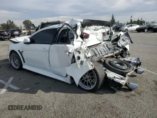 2014 Mitsubishi Lancer Evolution GSR with VIN JA32W8FV2EU019253, listed as a Copart auction lot 86615084 with 104,894 mi miles and Salvage Title. Bid and sale history available at carsss.com. Image 2.