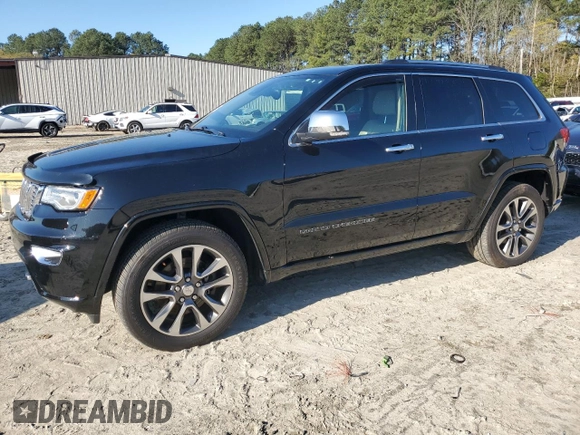 2017 Jeep Grand Cherokee Overland with VIN 1C4RJFCT3HC755960, listed as a Copart auction lot 52268895 with 99,998 mi miles and Salvage title. Bid and sale history available at DreamBid. Image 1.