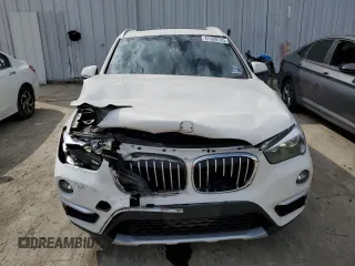 2019 BMW X1 xDrive28i with VIN WBXHT3C59K5L90317, listed as a Copart auction lot 61028125 with 46,789 mi miles and Salvage title. Bid and sale history available at DreamBid. Image 5.