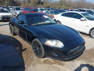 2007 Jaguar XK with VIN SAJDA44B975B01444, listed as a IAAI auction lot 41606094 with 155,227 mi miles. Bid and sale history available at carsss.com. Image 1.