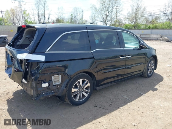 2014 Honda Odyssey Touring with VIN 5FNRL5H94EB079518, listed as a IAAI auction lot 42095098 with 141,019 mi miles and . Bid and sale history available at DreamBid. Image 4.