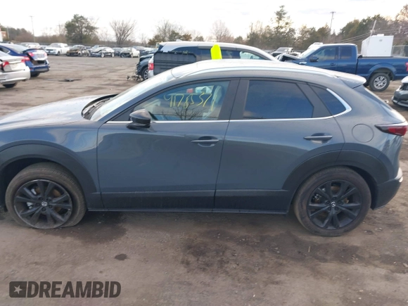 2023 Mazda CX-30 S Carbon Edition with VIN 3MVDMBCM1PM573317, listed as a IAAI auction lot 41785371 with 6,475 mi miles and . Bid and sale history available at DreamBid. Image 14.