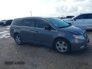 2011 Honda Odyssey Touring with VIN 5FNRL5H93BB104436, listed as a IAAI auction lot 40426003 with 93,342 mi miles and . Bid and sale history available at DreamBid. Image 1.