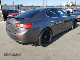 2015 Maserati Ghibli z VIN ZAM57XSA2F1159407, wystawiony jako Copart lot #57806715 z przebiegiem 93 185 mil mil oraz Szkody całkowita. Historia ofert i sprzedaży dostępna na DreamBid. Obrazek 3.