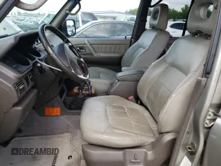 1998 Mitsubishi Montero z VIN JA4MR51RXWJ006418, wystawiony jako Copart lot #54878275 z przebiegiem 225 110 mil mil oraz Szkoda całkowita • Salvage title. Historia ofert i sprzedaży dostępna na DreamBid. Obrazek 7.